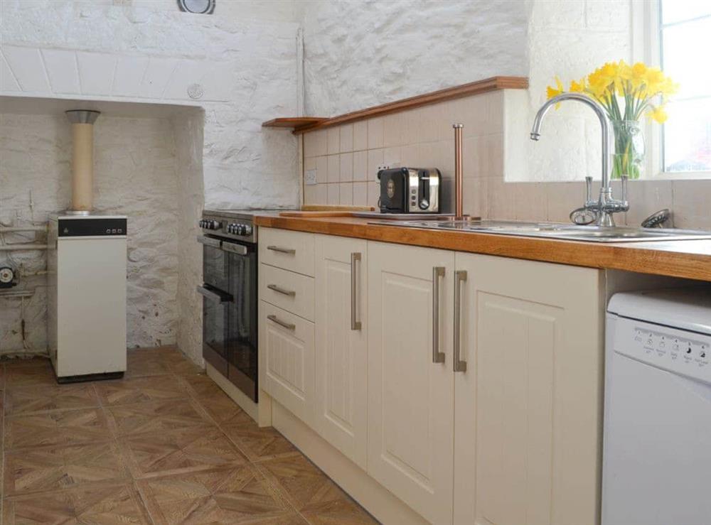 Lovely fitted kitchen at Porth Colmon Farmhouse in Porth Colmon, near Pwllheli, Gwynedd