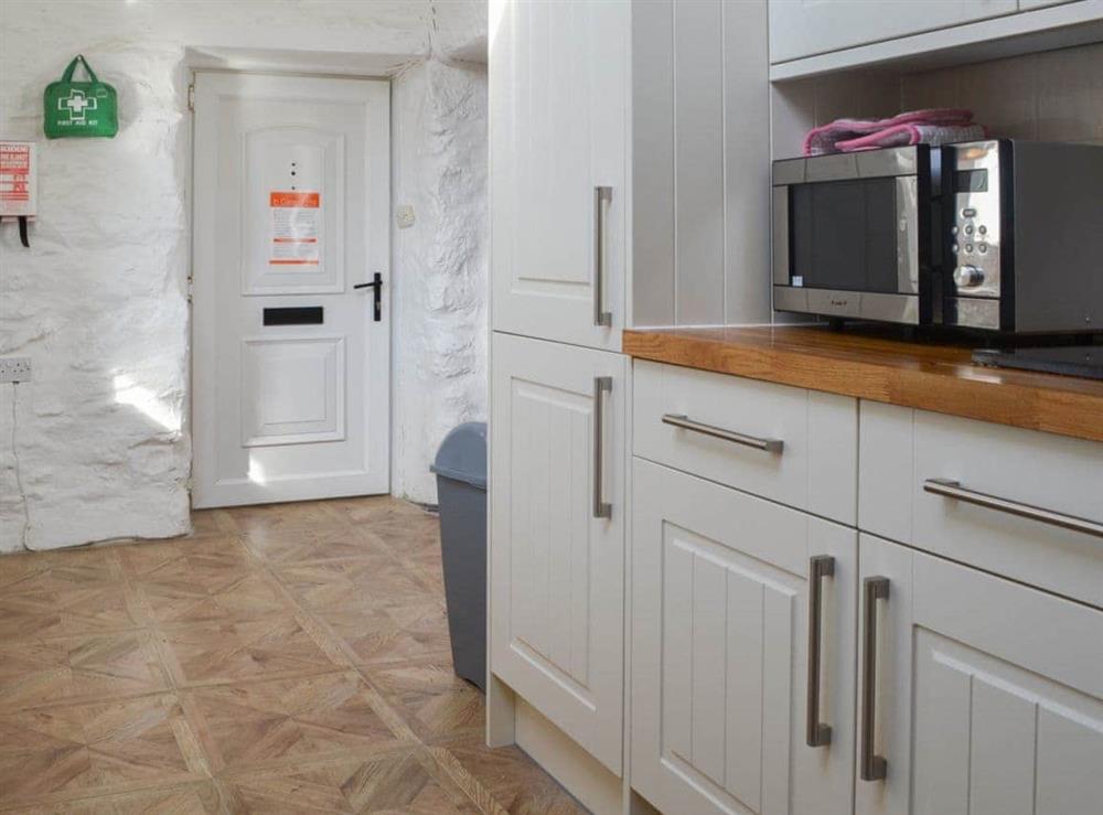 Well equipped and well appointed kitchen at Porth Colmon Farmhouse in Porth Colmon, near Pwllheli, Gwynedd