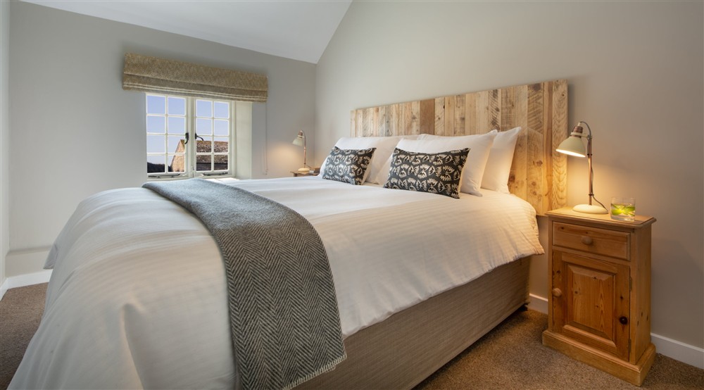 The super-king bedroom (with a zip-and-link bed that can be two singles on request) at Porth Mear Barn in Wadebridge, Cornwall
