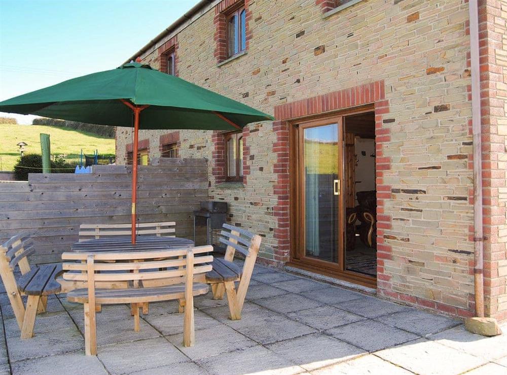 Lovely paved patio area with furniture at Porth View in St Mawgan, near Newquay, Cornwall