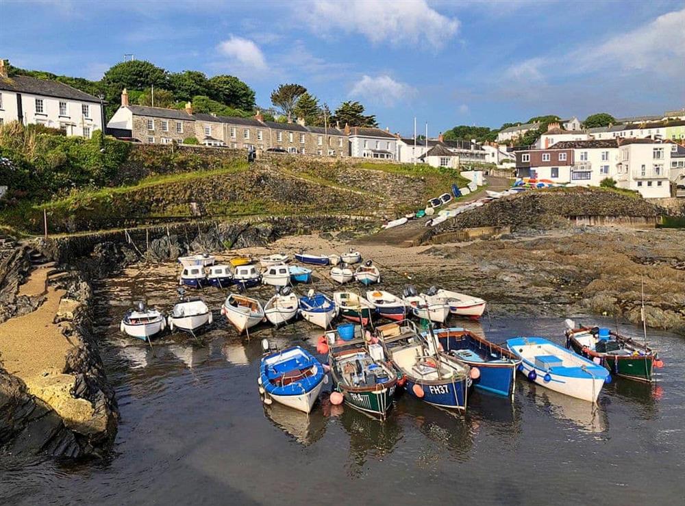 Porthgate from the harbour wall (middle house in the stone terrace) at Porthgate in Portscatho, Cornwall