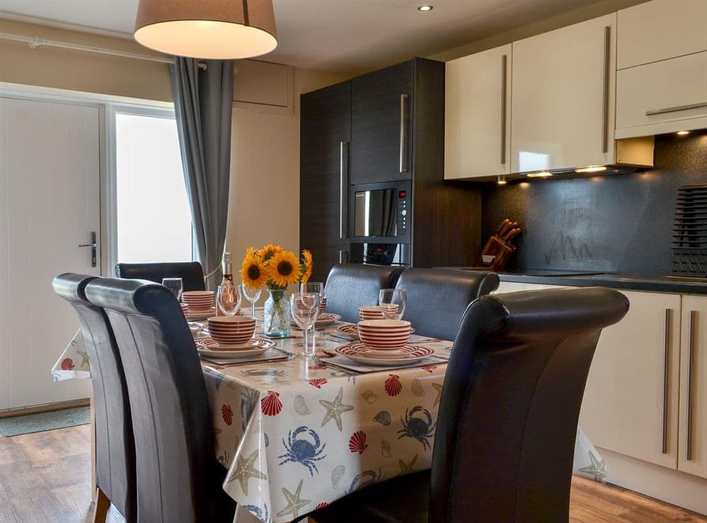 Well equipped kitchen/ dining area at Porthole Cottage in Allonby, near Maryport, Cumbria