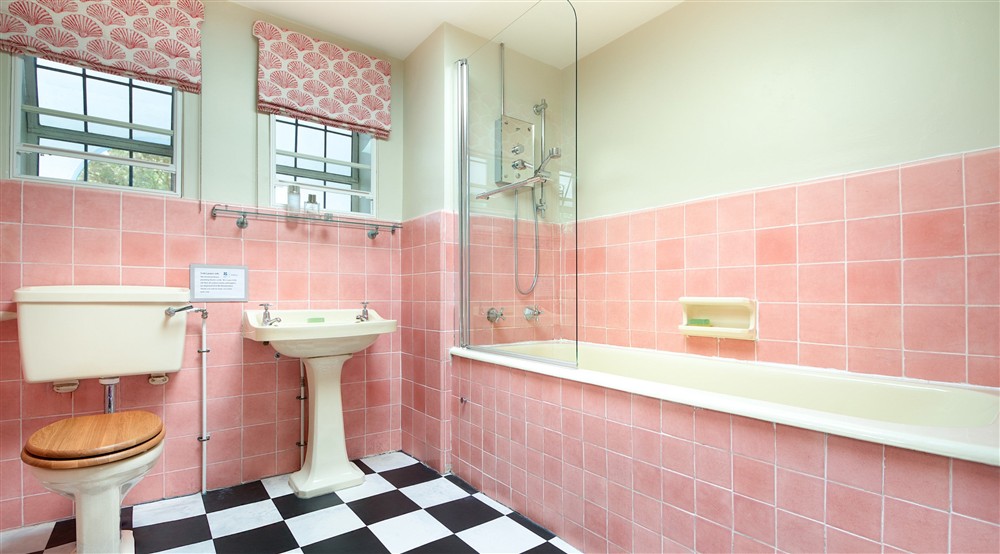 The bathroom on the ground floor of Portland House, with shower above bath, Dorset at Portland House in Weymouth, Dorset