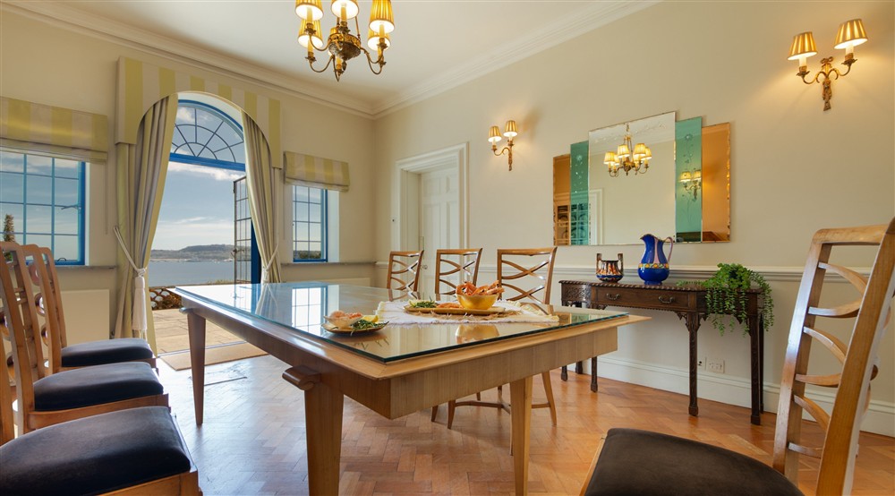 The dining room on the ground floor of Portland House, with patio doors onto the terrace, Dorset at Portland House in Weymouth, Dorset