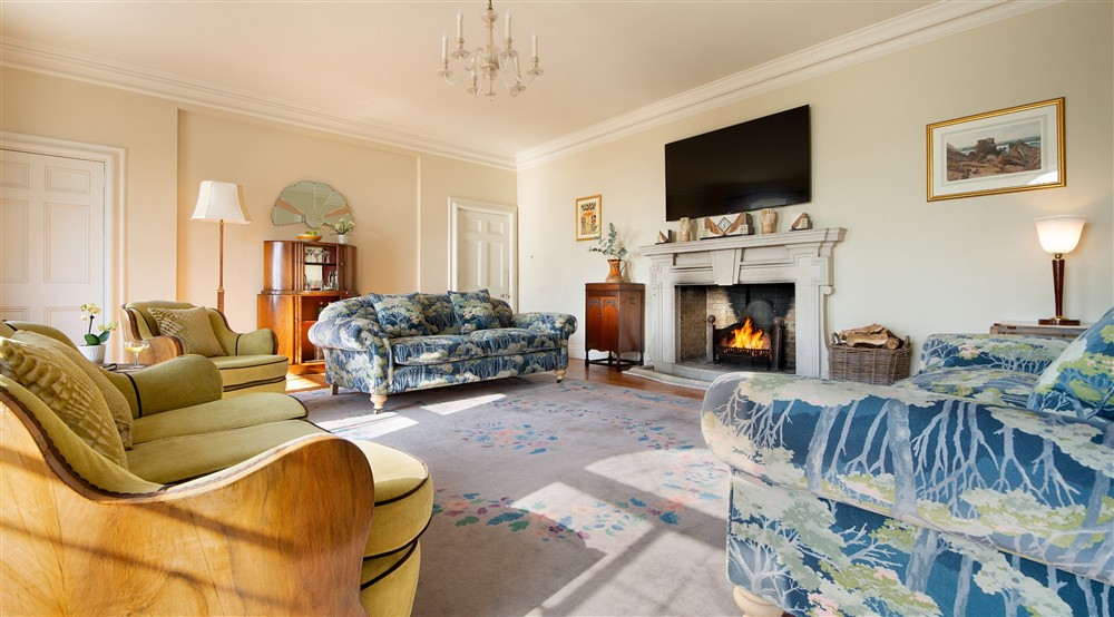 The drawing room on the ground floor of Portland House, with fireplace made of Portland Stone, Dorset at Portland House in Weymouth, Dorset