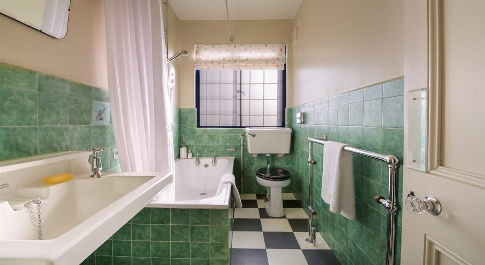 The green bathroom at Portland House in Weymouth, Dorset