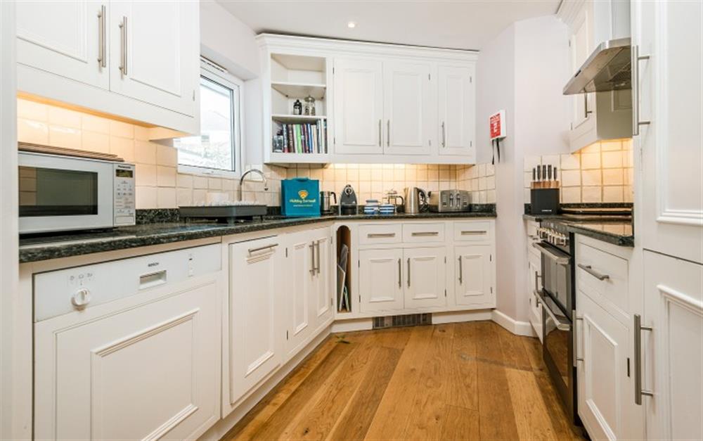 The modern kitchen is well equipped with full size appliances. at Portscatho in Helford Passage