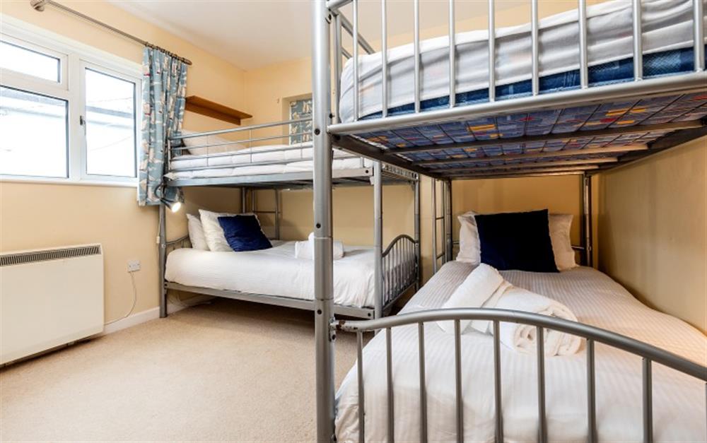 The spacious third bedroom has adult bunk beds. at Portscatho in Helford Passage