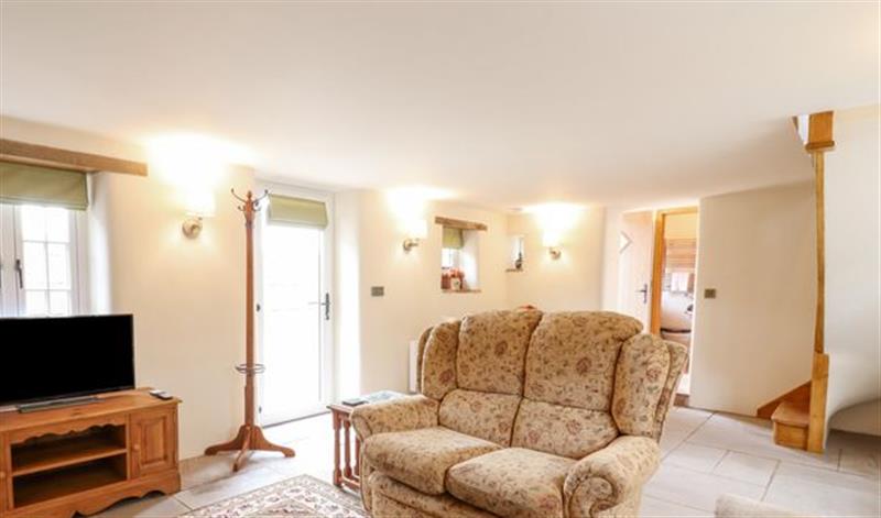 Relax in the living area at Postbox Cottage, Feltwell