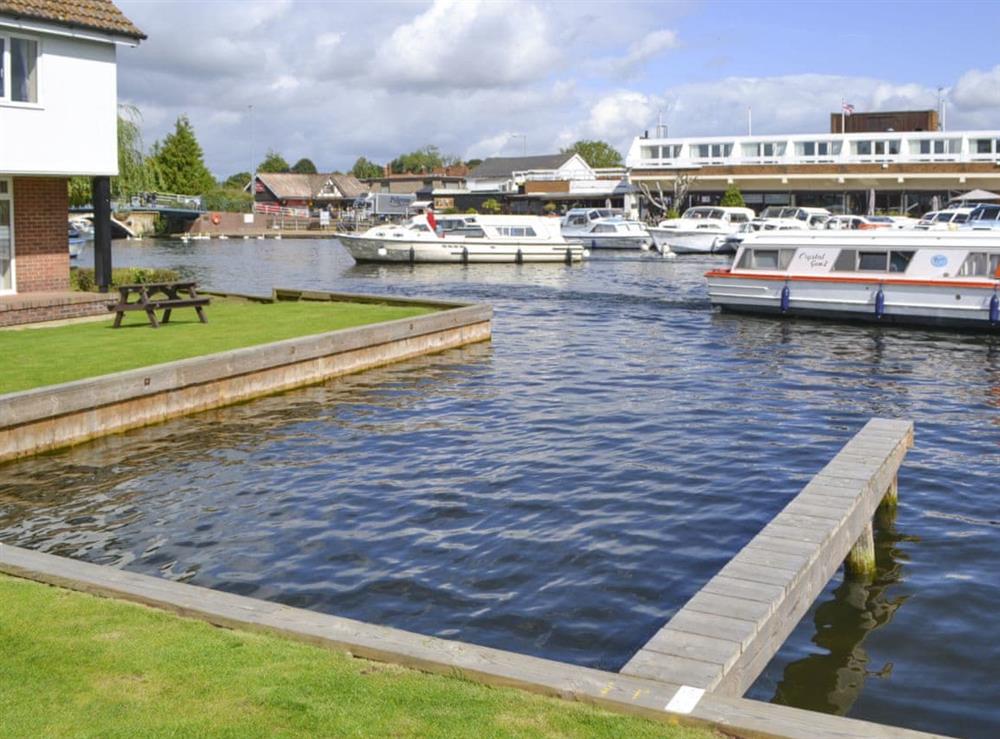 Relax and watch the boating activity along the river at Pottergate Cottage in Wroxham, Norfolk
