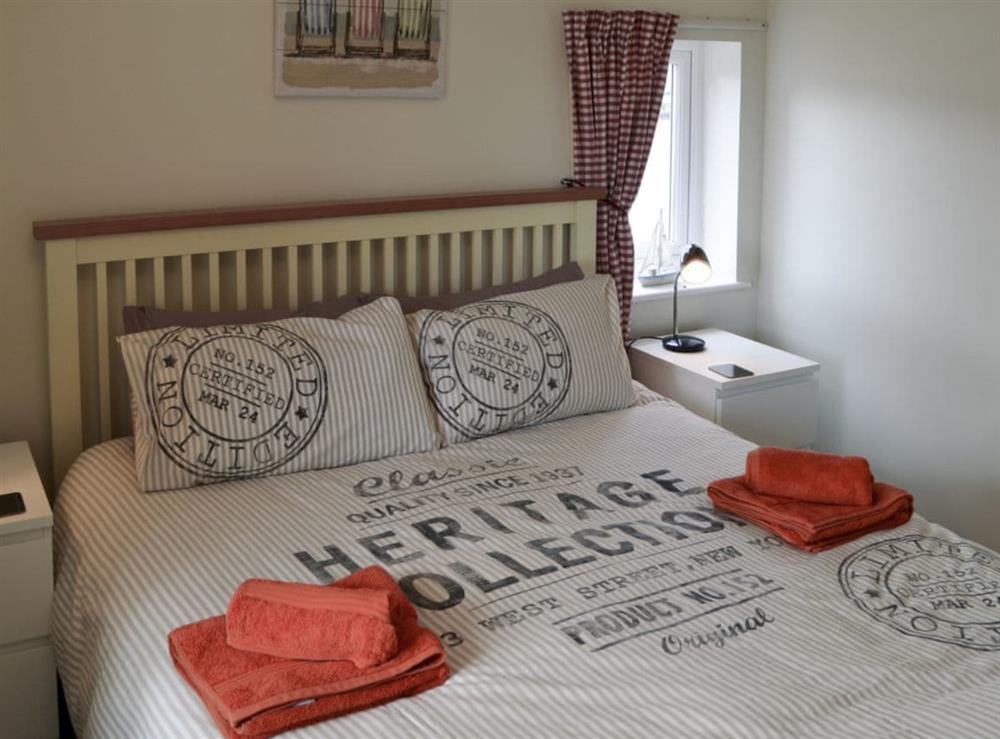 Relaxing bedroom with king-size bed and Freeview TV at Pottergate Cottage in Wroxham, Norfolk