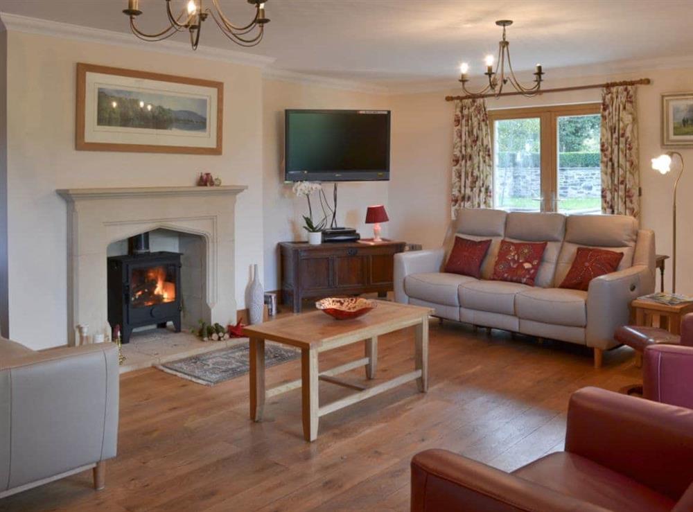 Living room with wood burning stove at Poulston House in Harbertonford, near Totnes, Devon