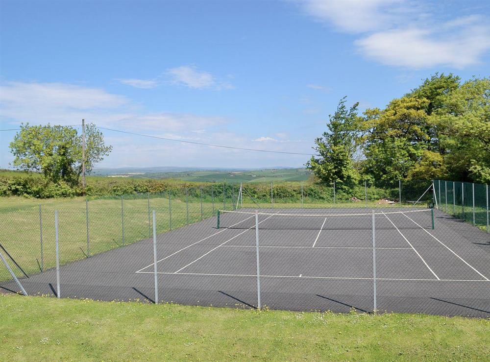 Tennis court at Poulston House in Harbertonford, near Totnes, Devon