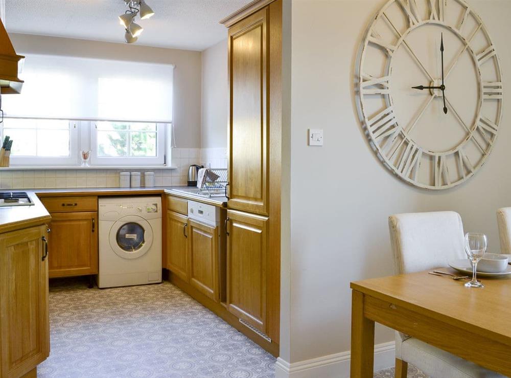 Well-equipped kitchen with convenient dining area at Powderhall Brae in Edinburgh, Midlothian