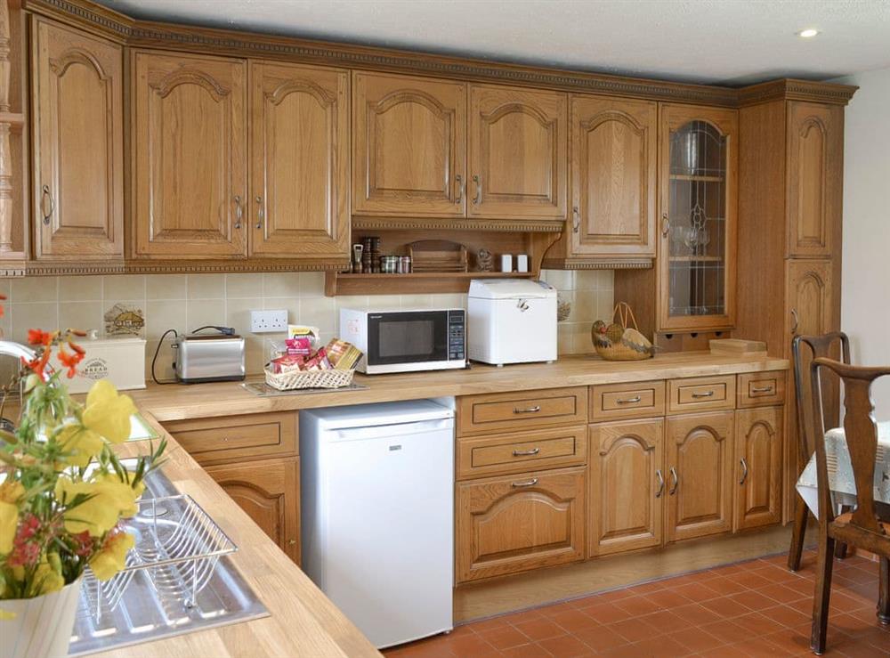 Light and airy kitchen with convenient dining area at Preswylfa in Llanddona, near Bangor, Anglesey, Gwynedd