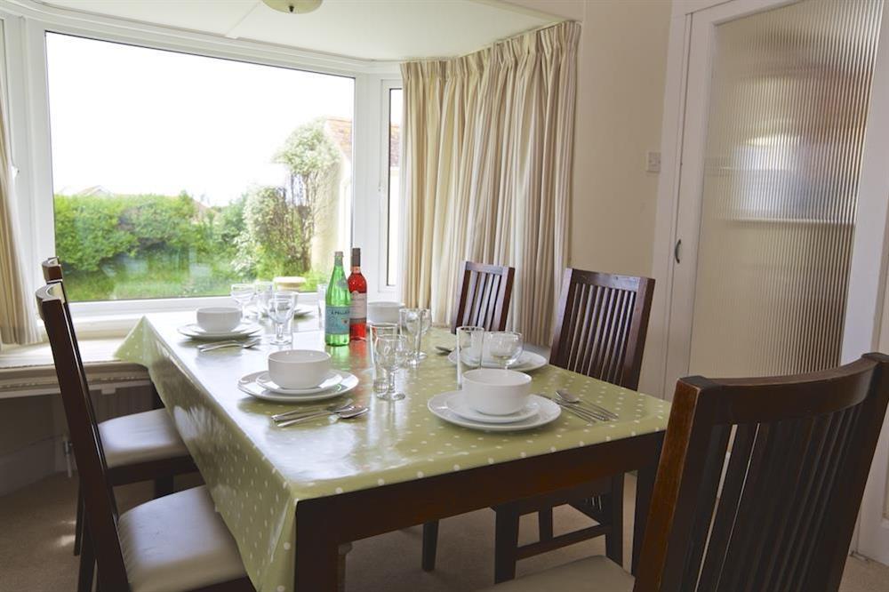 Dining room with views over the garden at Primrose Cottage (Thurlestone) in Thurlestone, Nr Kingsbridge