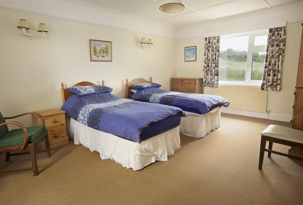 Ground floor bedroom with two single beds at Primrose Cottage (Thurlestone) in Thurlestone, Nr Kingsbridge
