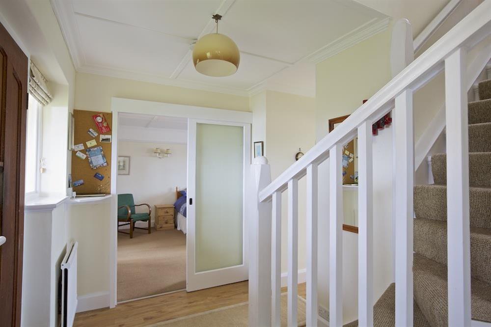 Hallway leading with stairs leading to the first floor bedrooms at Primrose Cottage (Thurlestone) in Thurlestone, Nr Kingsbridge