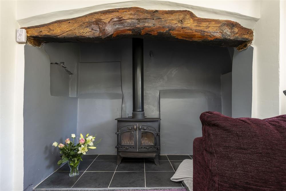 Inglenook fireplace with wood burning stove at Primrose Cottage, Dorchester
