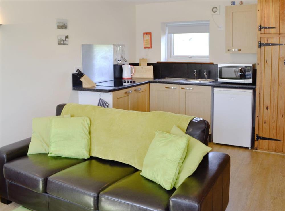 Open plan living/dining room/kitchen (photo 2) at Primrose Cottage in Dorchester, Dorset