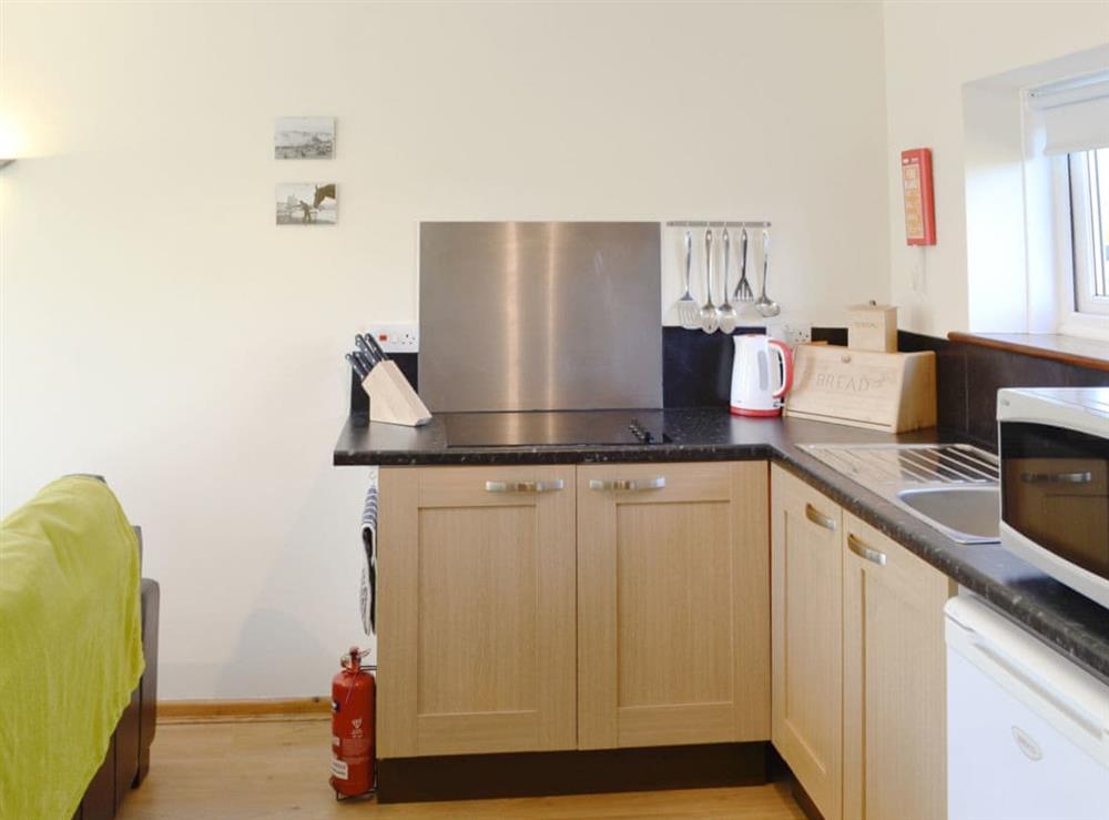 Open plan living/dining room/kitchen (photo 3) at Primrose Cottage in Dorchester, Dorset