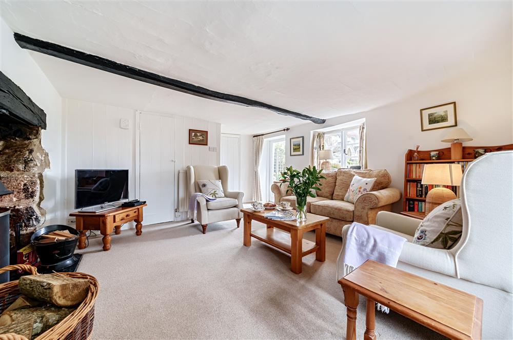 The cosy sitting room with its original features at Primrose Cottage, Drewsteignton