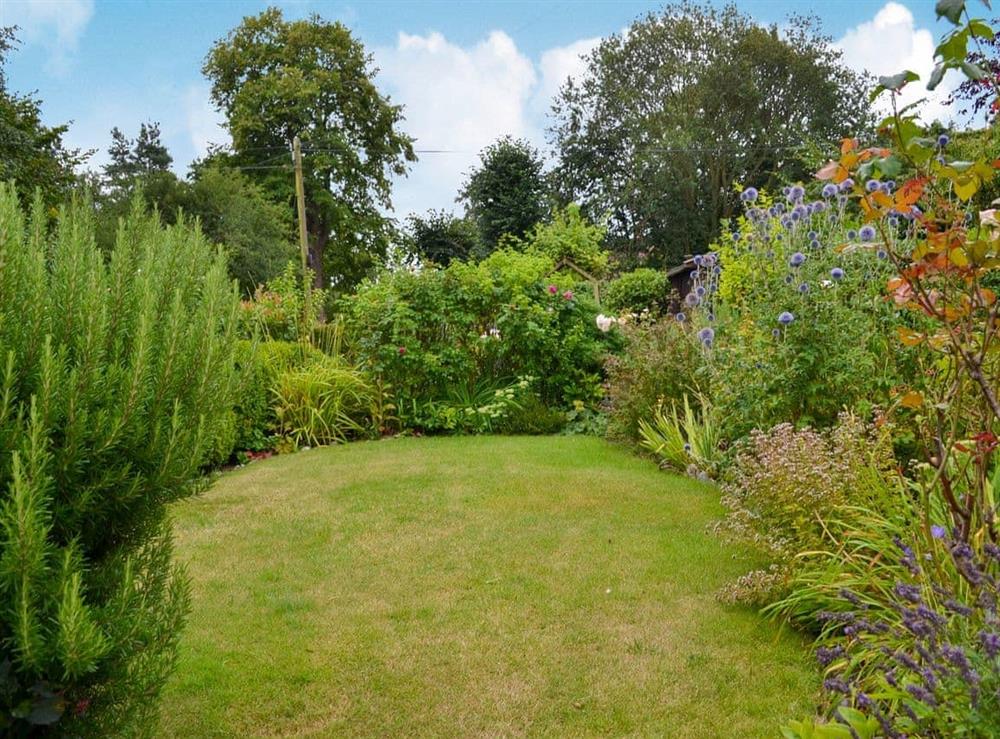 Enclosed country garden at Primrose Cottage in Gresham, Norfolk, Great Britain