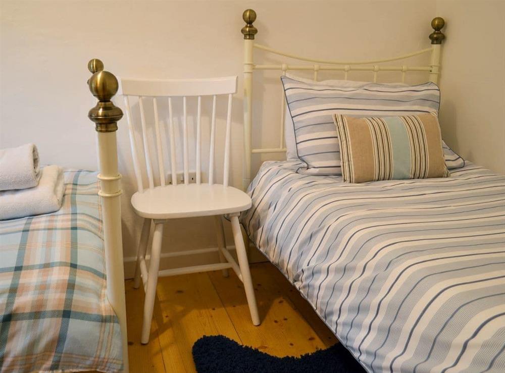 Twin bedroom at Primrose Cottage in Gresham, Norfolk, Great Britain