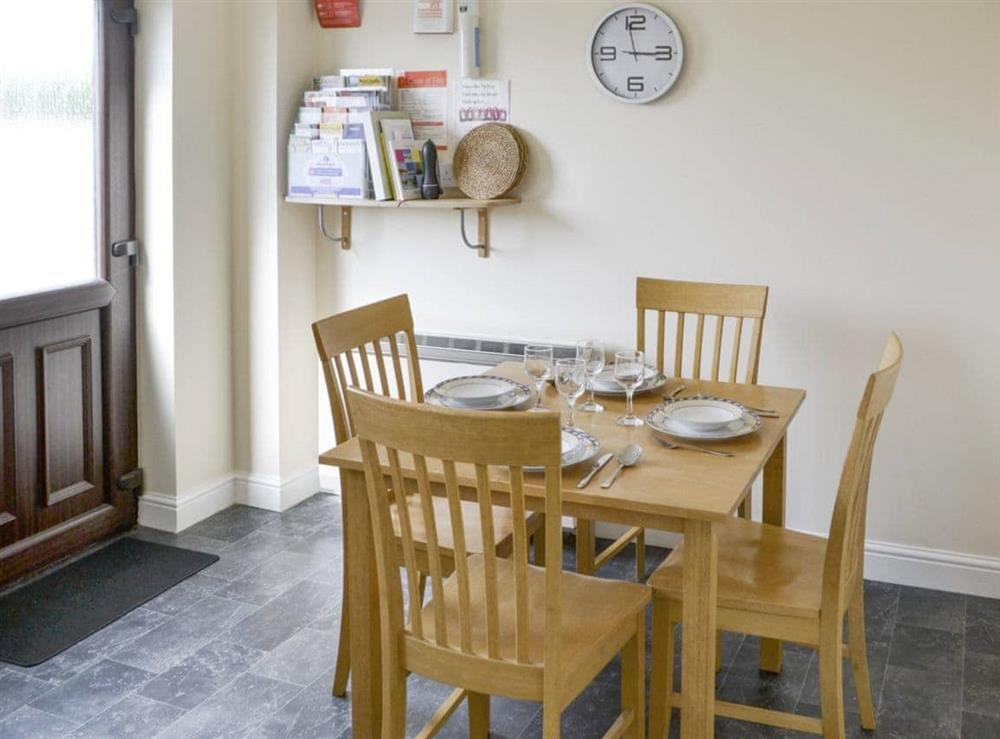 Convenient dining area within kitchen at Primrose Cottage in Sea Palling, Norfolk