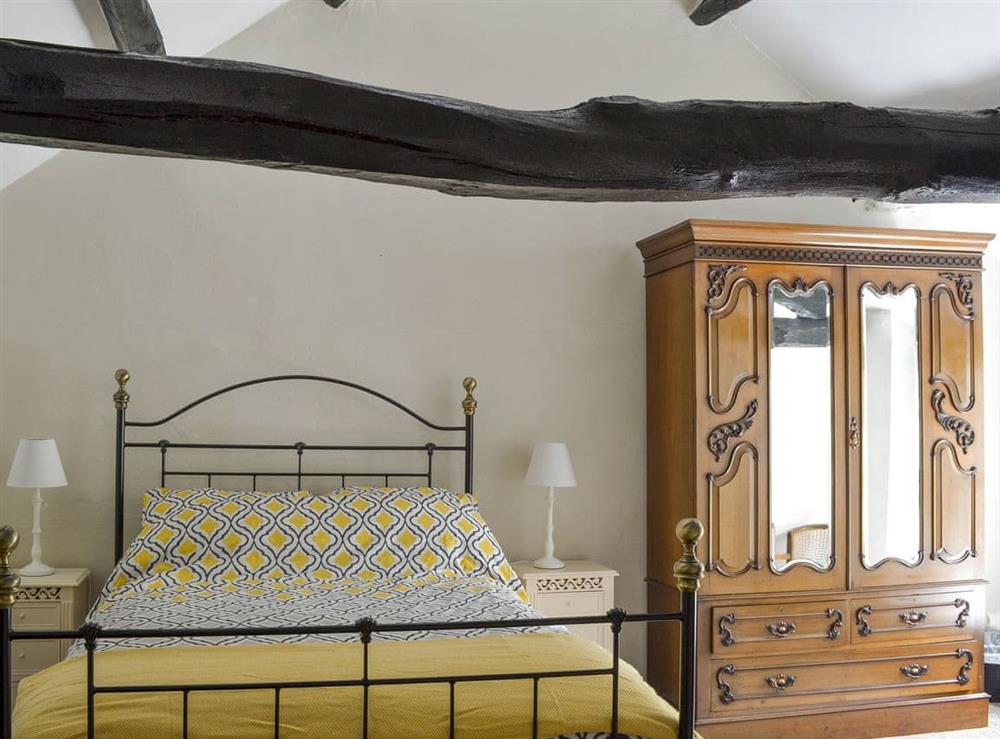 Airy double bedroom with heritage features at Primrose Cottage in Shap, near Penrith, Cumbria