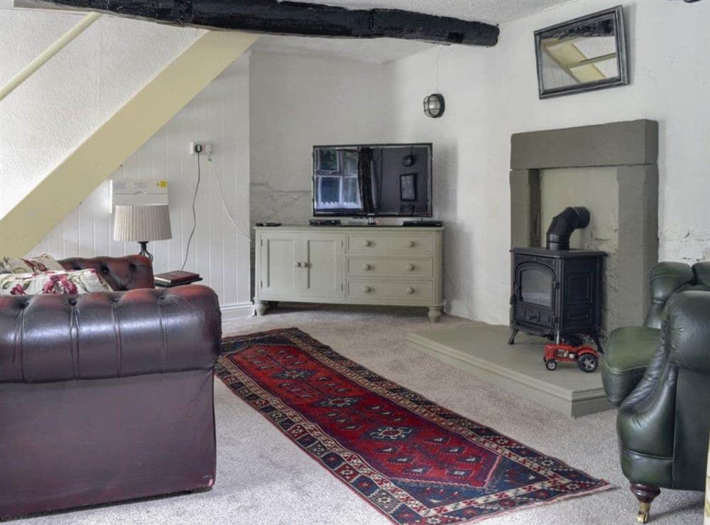 Cosy lounge with exposed wood beams at Primrose Cottage in Shap, near Penrith, Cumbria