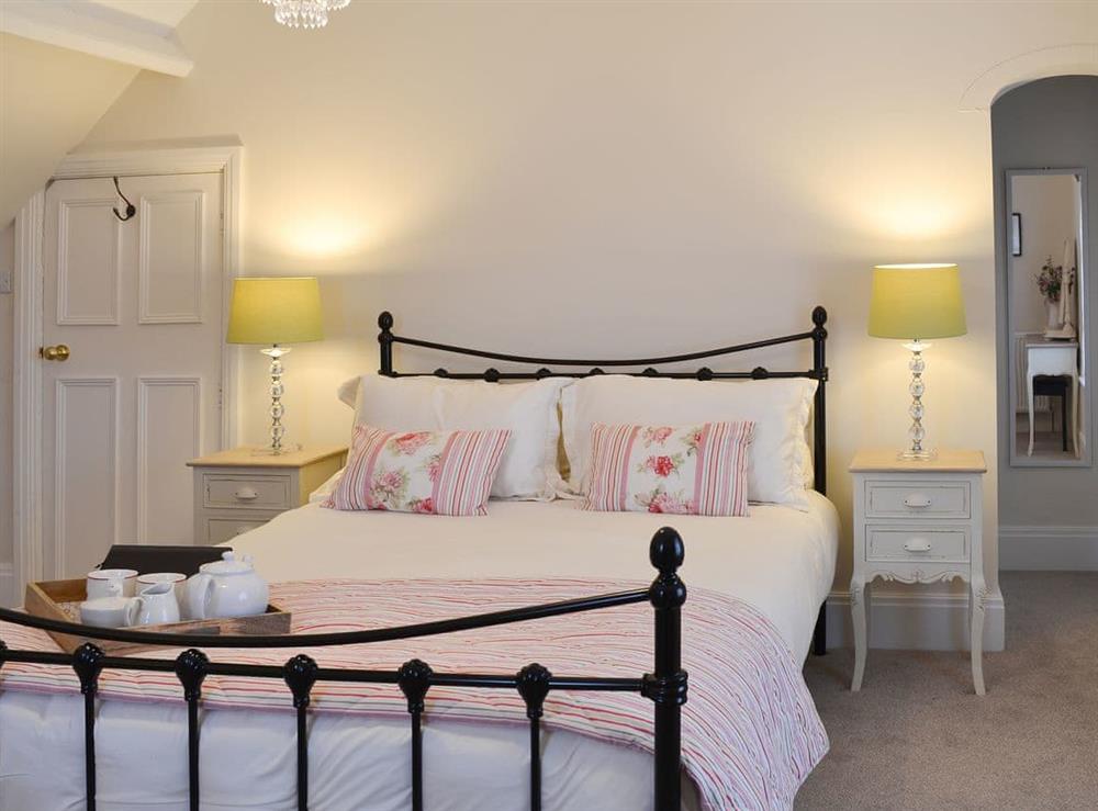 Double bedroom with antique style double bed at Princess Lodge in Scarborough, Yorkshire, North Yorkshire