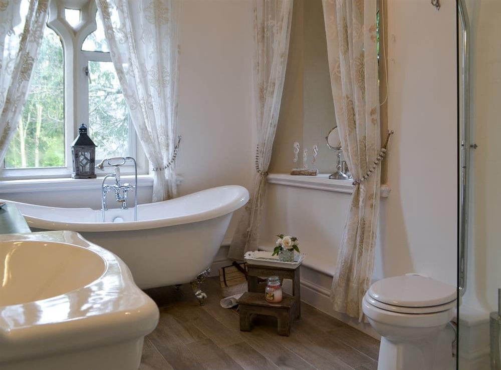 Bathroom with roll-top stand alone bath at Priory Manor in Windermere, Cumbria