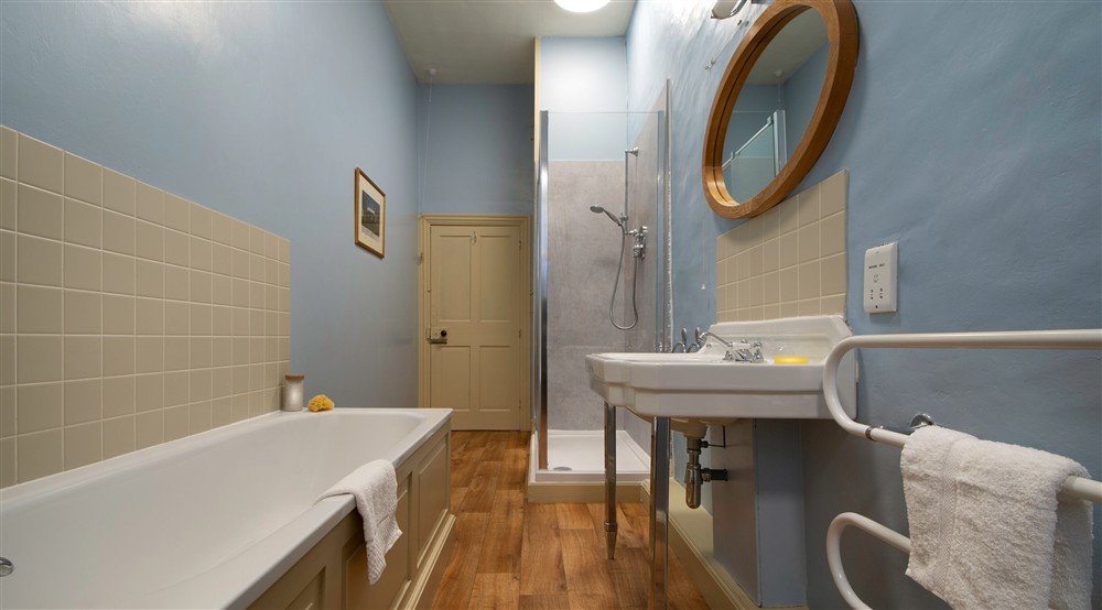 The bathroom with bath and walk-in shower at Proctor in Ripon, North Yorkshire