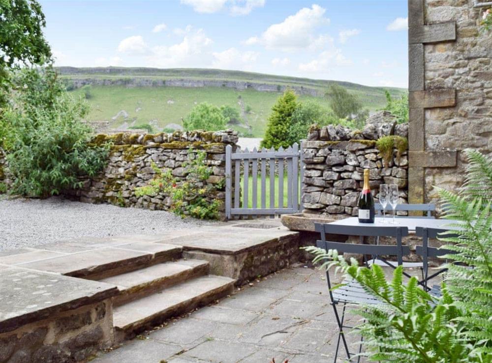 Outdoor seating area with countryside views at Prospect Cottage in Kettlewell, North Yorkshire