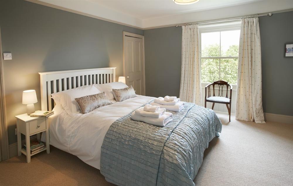 Master bedroom with king-size bed and en-suite shower room at Prospect House, Ampleforth