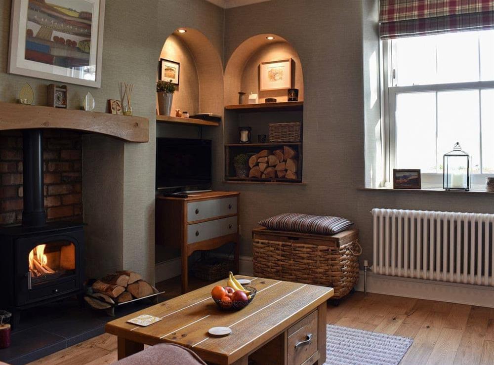 Cosy living room with wood burner at Prospect Terrace in Kendal, Cumbria