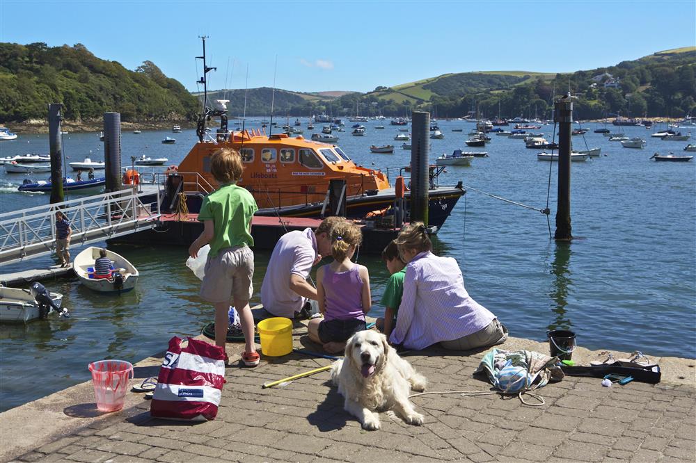 A family crabbing in Salcombe at Prospects in , Salcombe