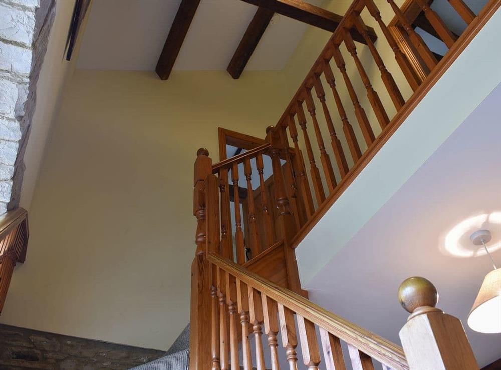 Elegant tuerning staircase and beamed ceiling