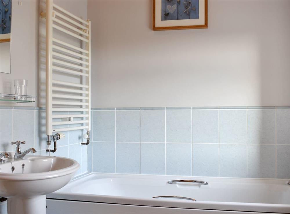 Bathroom with heated towel rail at The Stable, 
