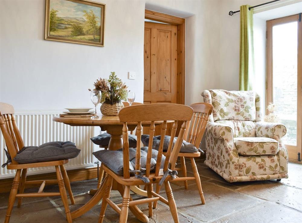 Modest dining table and chairs with a view at The Stable, 