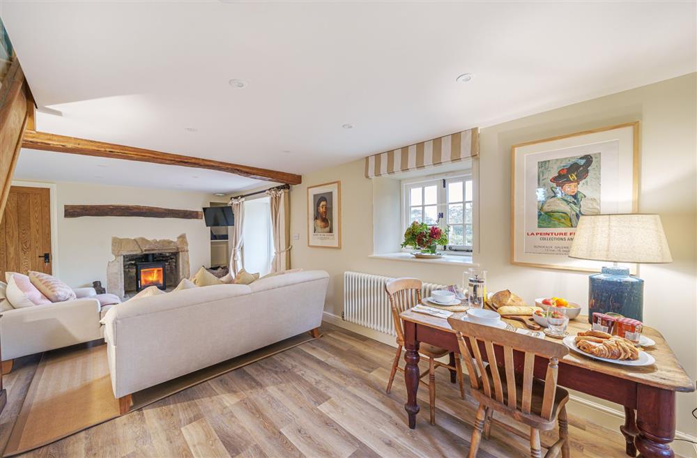 The open-plan sitting room with dining area at Puddle Cottage, Dorchester