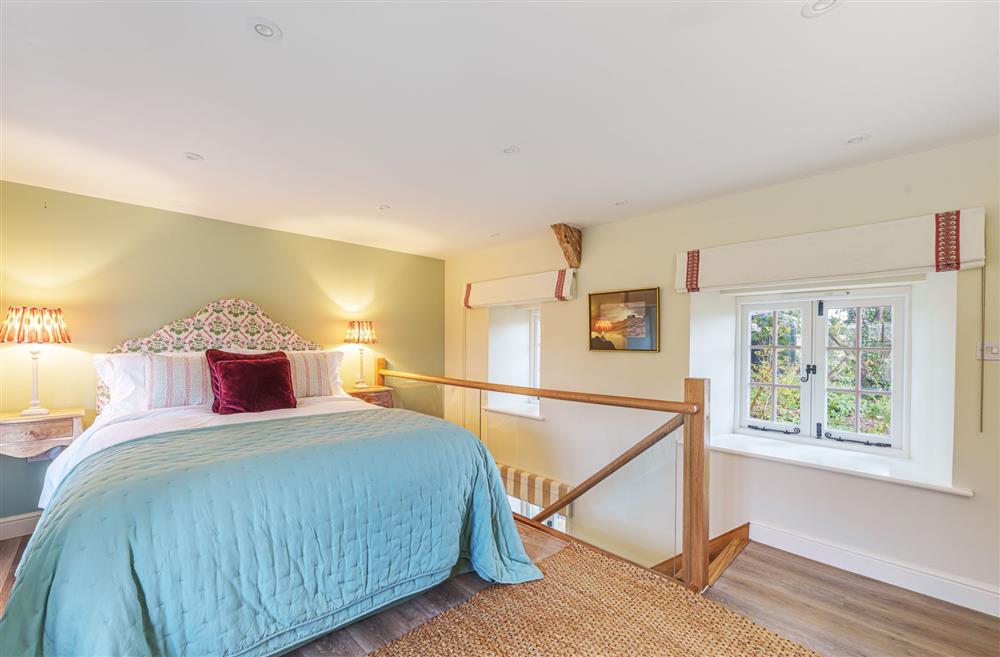 The stylish king-size bedroom at Puddle Cottage, Dorchester