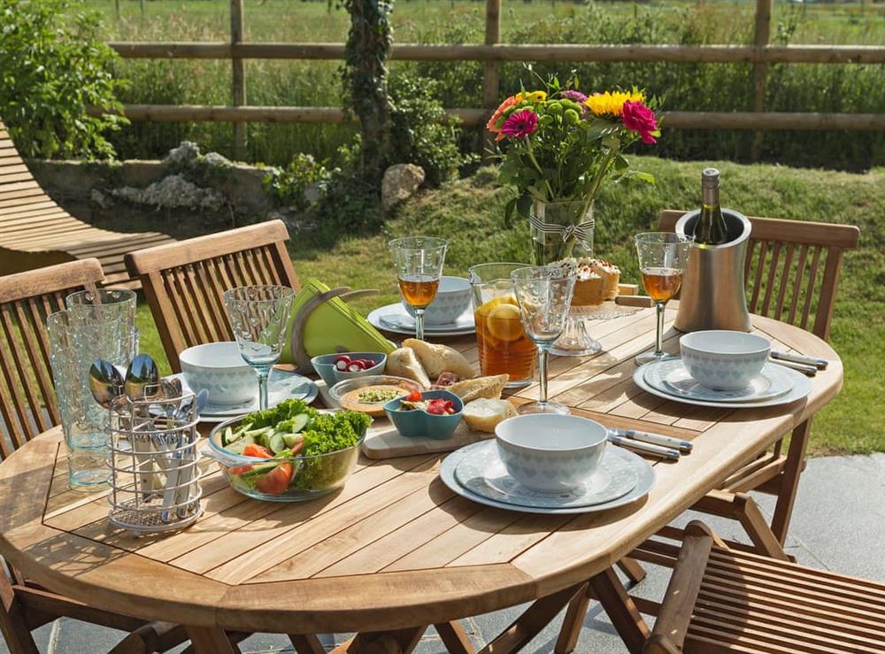 Inviting outdoor eating area at Puddledock Piggery in Berkley, near Frome, Somerset