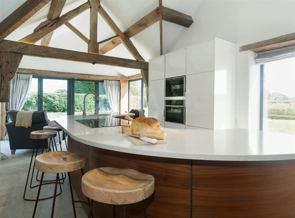 Tastefully modernised kitchen with breakfast bar (photo 3) at Puddledock Piggery in Berkley, near Frome, Somerset