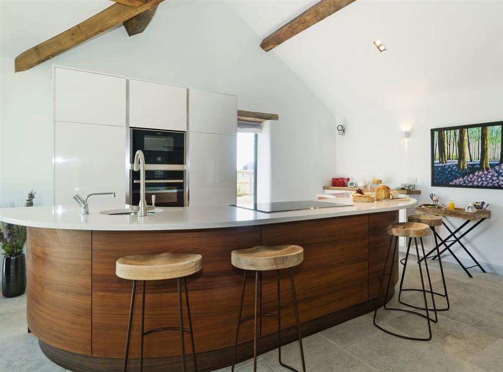 Tastefully modernised kitchen with breakfast bar at Puddledock Piggery in Berkley, near Frome, Somerset