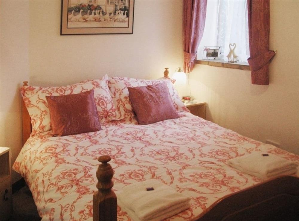 Double bedroom at Puddleduck Cottage in Thorpe Market, Norfolk