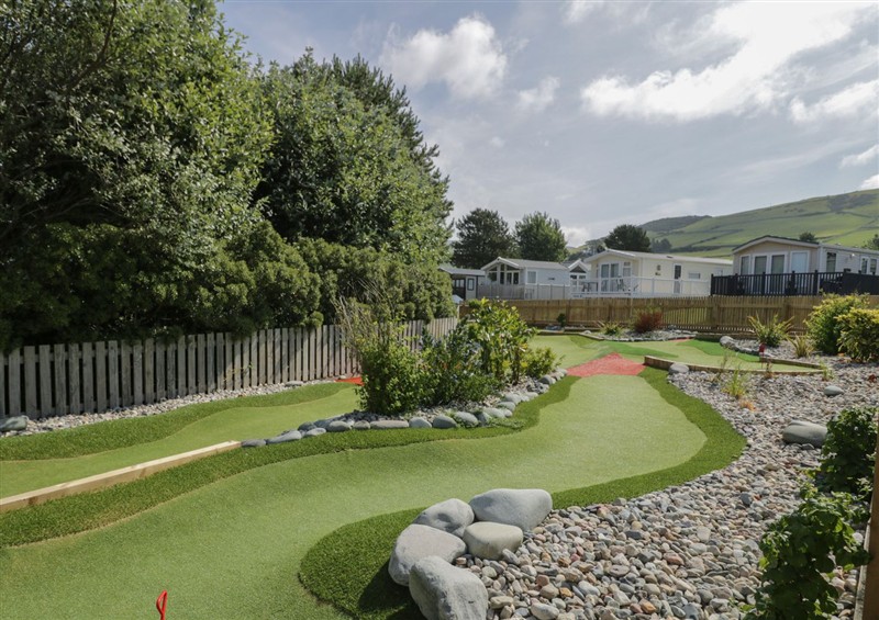 Enjoy the garden at Puffin Way Holiday Caravan, Llwyngwril