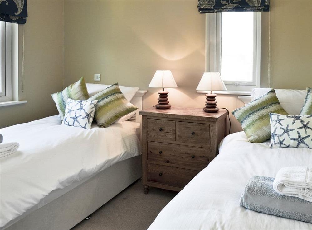 Comfortable bedroom with twin beds at Puffins in Beadnell, near Alnwick, Northumberland