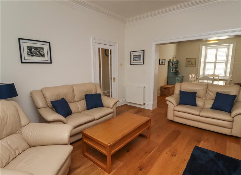 Relax in the living area at Puffins Reach, Amble
